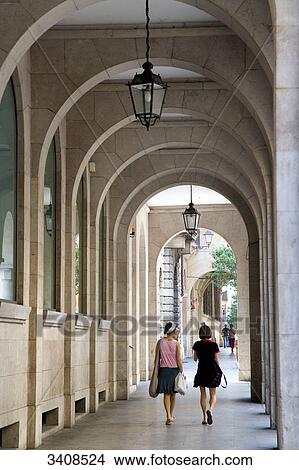 Two women walking under arcades, Vicenza, Italy View Large Photo Image Picture - Two women walking under arcades, Vicenza, Italy . Fotosearch