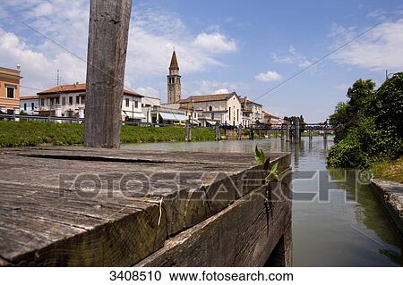 Stock Image - View of a drawbridge in Oriago, wooden jetty in the foreground, Venetia, Italy . Fotosearch