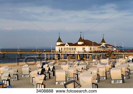 Stock Photo - View of Ahlbeck pier, Hooded Beach Chairs in the foreground, Usedom, Germany, elevated view . Fotosearch