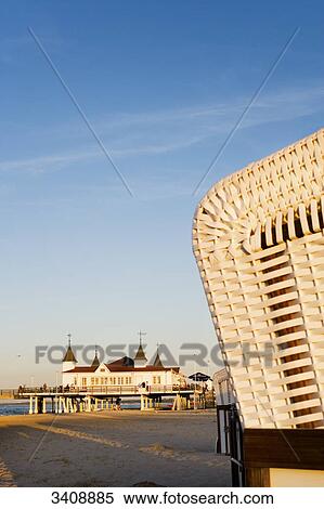 Stock Photography - View of Ahlbeck pier, hooded beach chairs in the foreground, Usedom, Germany . Fotosearch