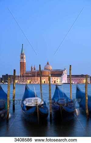 Stock Photograph - View of San Giorgio Maggiore, moored gondolas in the foreground, Venice, Italy . Fotosearch