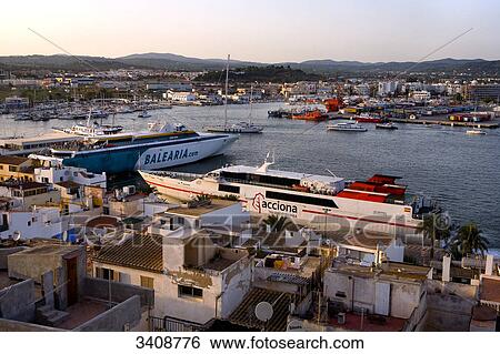 Stock Photograph - View of the harbour of Ibiza City, Ibiza, Spain, elevated view . Fotosearch