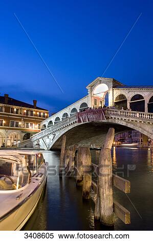 View of the Rialto Bridge, boat and wooden pillars in the foreground, Venice, Italy View Large Photo Image Stock Photography - View of the Rialto Bridge, boat and wooden pillars in the foreground, Venice, Italy . Fotosearch
