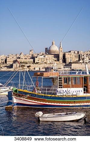 Stock Photo - View of Valletta, ship and boats in the foreground, Malta, elevated view . Fotosearch