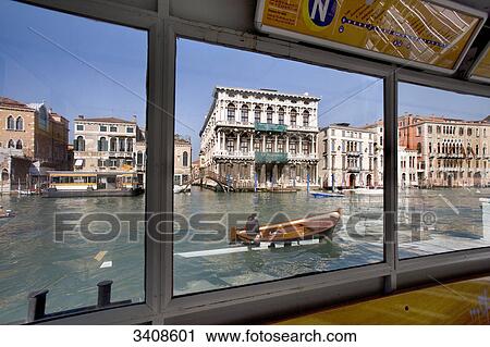 View through the window of a ferry on Canale Grande with Ca Rezzonico in the background, Venice, Italy  View Large Photo Image Stock Image - View through the window of a ferry on Canale Grande with Ca Rezzonico in the background, Venice, Italy . Fotosearch