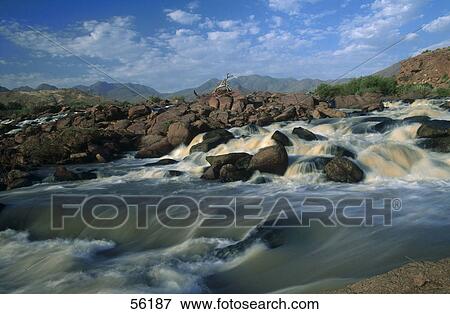 Water flowing through rocks, Water Marienfluss Valley, Namibia View Large Photo Image Stock Photo - Water flowing through rocks, Water Marienfluss Valley, Namibia . Fotosearch