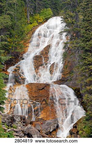 Stock Photo - Waterfall in forest, Anaconda Pintler Wilderness, Montana, USA . Fotosearch