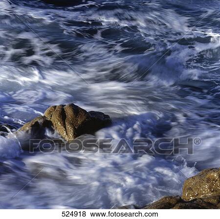 Stock Photo - Waves on beach . Fotosearch