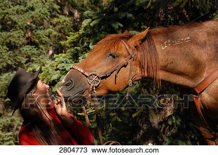 Woman standing with horse in forest, Weminuche Wilderness, Colorado, USA View Large Photo Image Stock Image - Woman standing with horse in forest, Weminuche Wilderness, Colorado, USA . Fotosearch