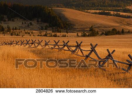 Wooden fence in field, Montana, USA View Large Photo Image Stock Photograph - Wooden fence in field, Montana, USA . Fotosearch