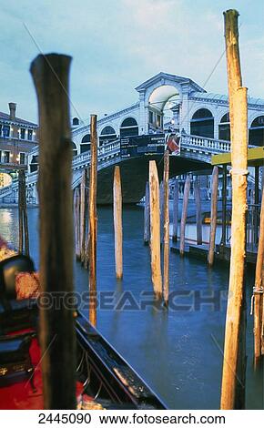 Wooden posts in canal, Rialto Bridge, Grand Canal, Venice, Italy View Large Photo Image Stock Image - Wooden posts in canal, Rialto Bridge, Grand Canal, Venice, Italy . Fotosearch