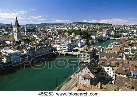 Stock Image - Aerial view of canal flowing through city . Fotosearch
