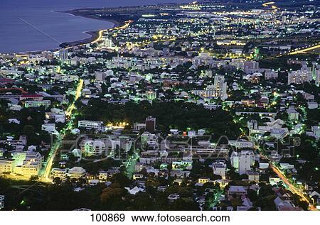 Aerial view of city lit up at night, St-Denis, Reunion Island, France View Large Photo Image Stock Photo - Aerial view of city lit up at night, St-Denis, Reunion Island, France . Fotosearch