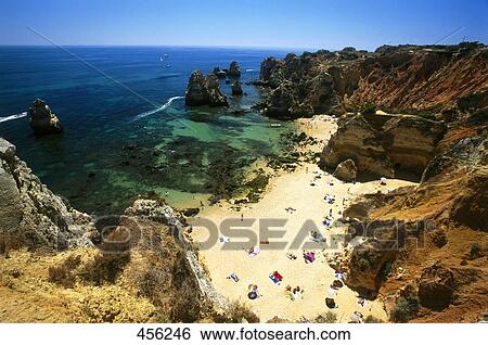 Aerial view of tourists on beach, Algarve, Portugal View Large Photo Image Stock Photograph - Aerial view of tourists on beach, Algarve, Portugal . Fotosearch