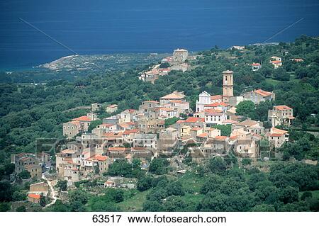 Stock Photo - Aerial view of town on hill, Balagne, France . Fotosearch