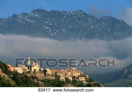 Aerial view of town on mountain at dusk, Balagne, France View Large Photo Image Stock Photo - Aerial view of town on mountain at dusk, Balagne, France . Fotosearch