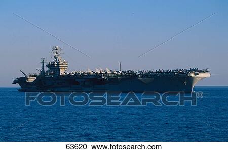 Aircraft carrier sailing in sea against clear blue sky, Rhodes, Dodecanese Islands, Greece View Large Photo Image Stock Image - Aircraft carrier sailing in sea against clear blue sky, Rhodes, Dodecanese Islands, Greece . Fotosearch