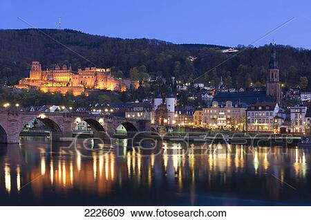 Arch bridge across river lit up at dusk, River Neckar, Germany View Large Photo Image Stock Photo - Arch bridge across river lit up at dusk, River Neckar, Germany . Fotosearch