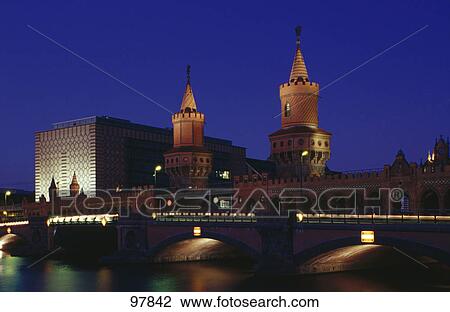 Stock Image - Arch bridge across river, Oberbaumbrucke, Berlin, Germany . Fotosearch