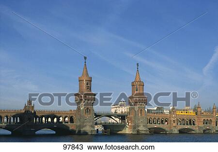 Arch bridge across river, Oberbaumbrucke, Berlin, Germany View Large Photo Image Stock Image - Arch bridge across river, Oberbaumbrucke, Berlin, Germany . Fotosearch