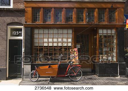 Stock Photo - Bicycle parked in front of store, Utrecht, Netherlands . Fotosearch