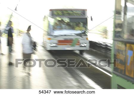 Blurred view of bus arriving at bus stop View Large Photo Image Stock Photo - Blurred view of bus arriving at bus stop . Fotosearch