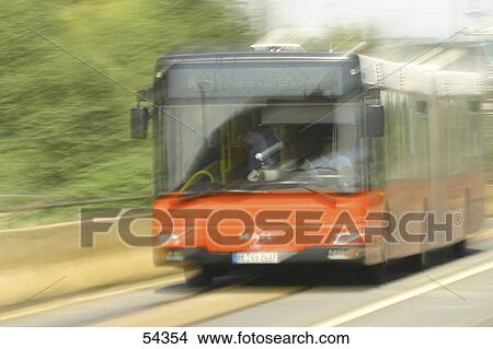 Blurred view of bus in motion on road View Large Photo Image Picture - Blurred view of bus in motion on road . Fotosearch