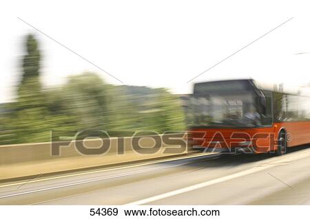 Blurred view of bus in motion on road  View Large Photo Image Stock Photo - Blurred view of bus in motion on road . Fotosearch