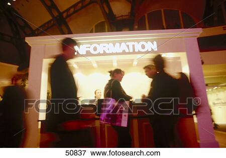 Blurred view of people in front of information counter View Large Photo Image Stock Photo - Blurred view of people in front of information counter . Fotosearch