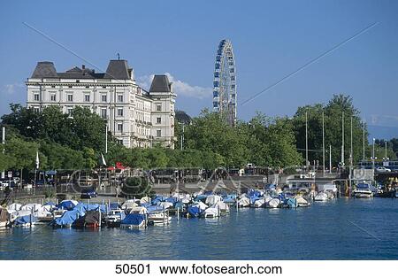 Stock Image - Boats in river water, River Limmat, Zurich, Switzerland . Fotosearch