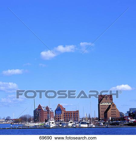 Stock Image - Boats moored at harbor, Germany . Fotosearch