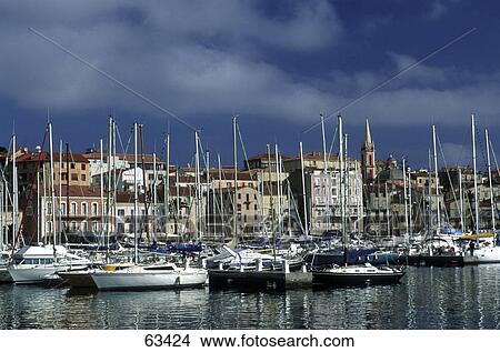 Boats moored at harbor, La Balagne, Corsica, Haute-Corse, France View Large Photo Image Picture - Boats moored at harbor, La Balagne, Corsica, Haute-Corse, France . Fotosearch