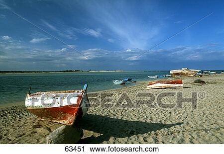 Boats moored on beach, Djerba, Tunisia View Large Photo Image Stock Image - Boats moored on beach, Djerba, Tunisia . Fotosearch