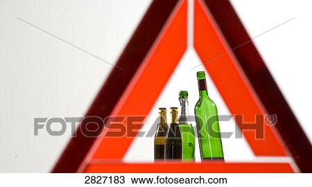 Bottles of alcohol behind breakdown triangle View Large Photo Image Stock Image - Bottles of alcohol behind breakdown triangle . Fotosearch