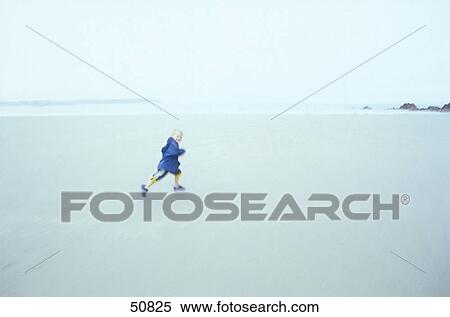 Boy running on beach View Large Photo Image Stock Photography - Boy running on beach . Fotosearch