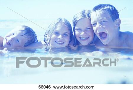 Boys and girls playing in water on beach View Large Photo Image Stock Photograph - Boys and girls playing in water on beach . Fotosearch