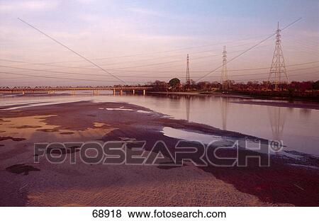 Bridge across river at dusk, Punjab, Pakistan View Large Photo Image Stock Photo - Bridge across river at dusk, Punjab, Pakistan . Fotosearch