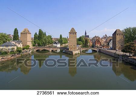 Bridge across river, Les Ponts Couverts, Ill River, Alsace, Strasbourg, France View Large Photo Image Stock Image - Bridge across river, Les Ponts Couverts, Ill River, Alsace, Strasbourg, France . Fotosearch