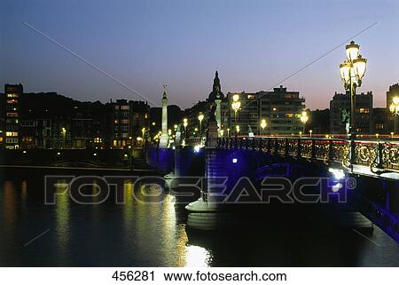Bridge across river lit up at night, Arch Bridge, Belgium View Large Photo Image Stock Image - Bridge across river lit up at night, Arch Bridge, Belgium . Fotosearch