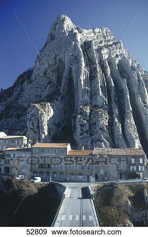 Bridge leading to buildings on hill, Sisteron, Provence, France View Large Photo Image Stock Photo - Bridge leading to buildings on hill, Sisteron, Provence, France . Fotosearch