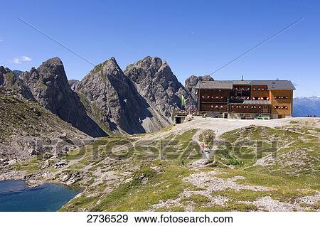 Building near mountains, Lienzer Dolomiten, Lienz, Tyrol, Austria View Large Photo Image Stock Photo - Building near mountains, Lienzer Dolomiten, Lienz, Tyrol, Austria . Fotosearch