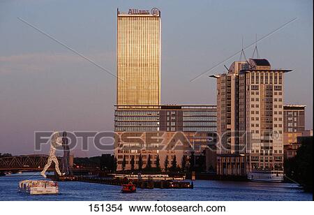Buildings at waterfront, Allianz Tower, Treptow, Spree River, Berlin, Germany View Large Photo Image Picture - Buildings at waterfront, Allianz Tower, Treptow, Spree River, Berlin, Germany . Fotosearch
