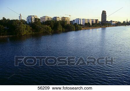 Buildings in a city at the waterfront, Frankfurt, Germany View Large Photo Image Stock Photo - Buildings in a city at the waterfront, Frankfurt, Germany . Fotosearch