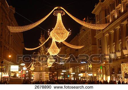 Buildings lit up at night in city, Vienna, Austria View Large Photo Image Stock Image - Buildings lit up at night in city, Vienna, Austria . Fotosearch