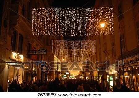 Stock Photo - Buildings lit up at night in city, Vienna, Austria . Fotosearch