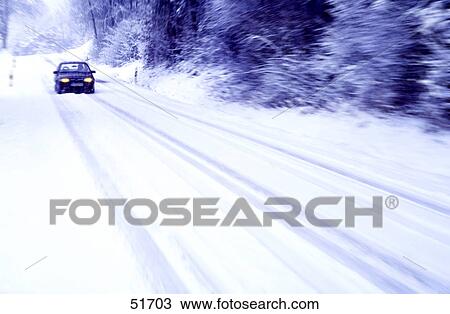 Stock Image - Car on snowy street . Fotosearch