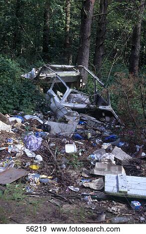 Car wreck and litter in forest View Large Photo Image Stock Photo - Car wreck and litter in forest . Fotosearch