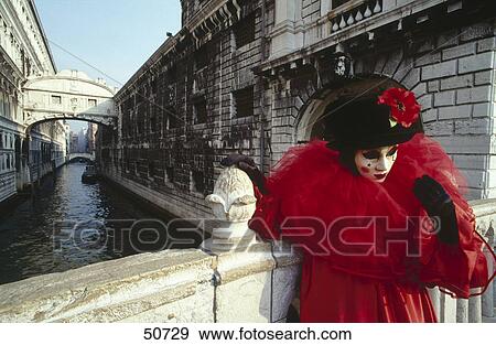Carnival participant in costume on bridge over canal, Venice, Italy View Large Photo Image Stock Photo - Carnival participant in costume on bridge over canal, Venice, Italy . Fotosearch