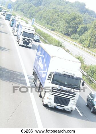 Cars and trucks on road View Large Photo Image Stock Photograph - Cars and trucks on road . Fotosearch