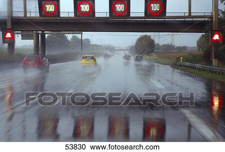 Cars on highway in rain View Large Photo Image Stock Image - Cars on highway in rain . Fotosearch